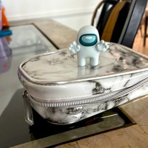 Selling a bundle of a marble bag with a figure! All new. Get bag and figure now!